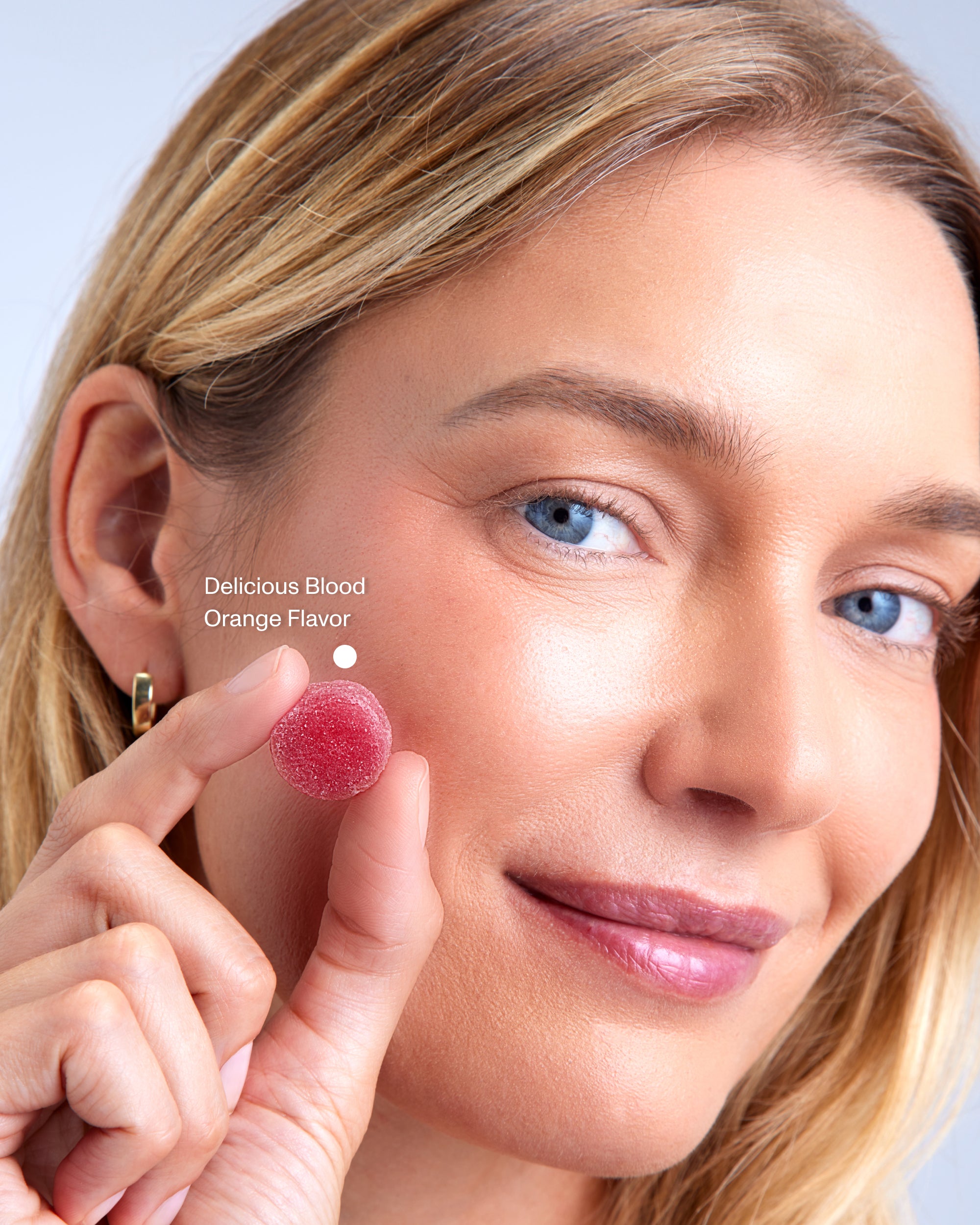 FOCL FeelGood Gummies - Close-up of a person enjoying a gummy - Promoting calm and focus.