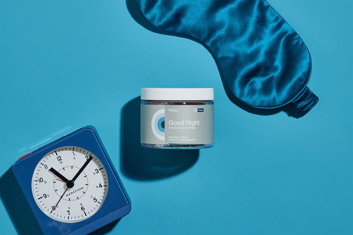 FOCL CBD and CBN gummies in a blue container promoting calm and restful sleep.