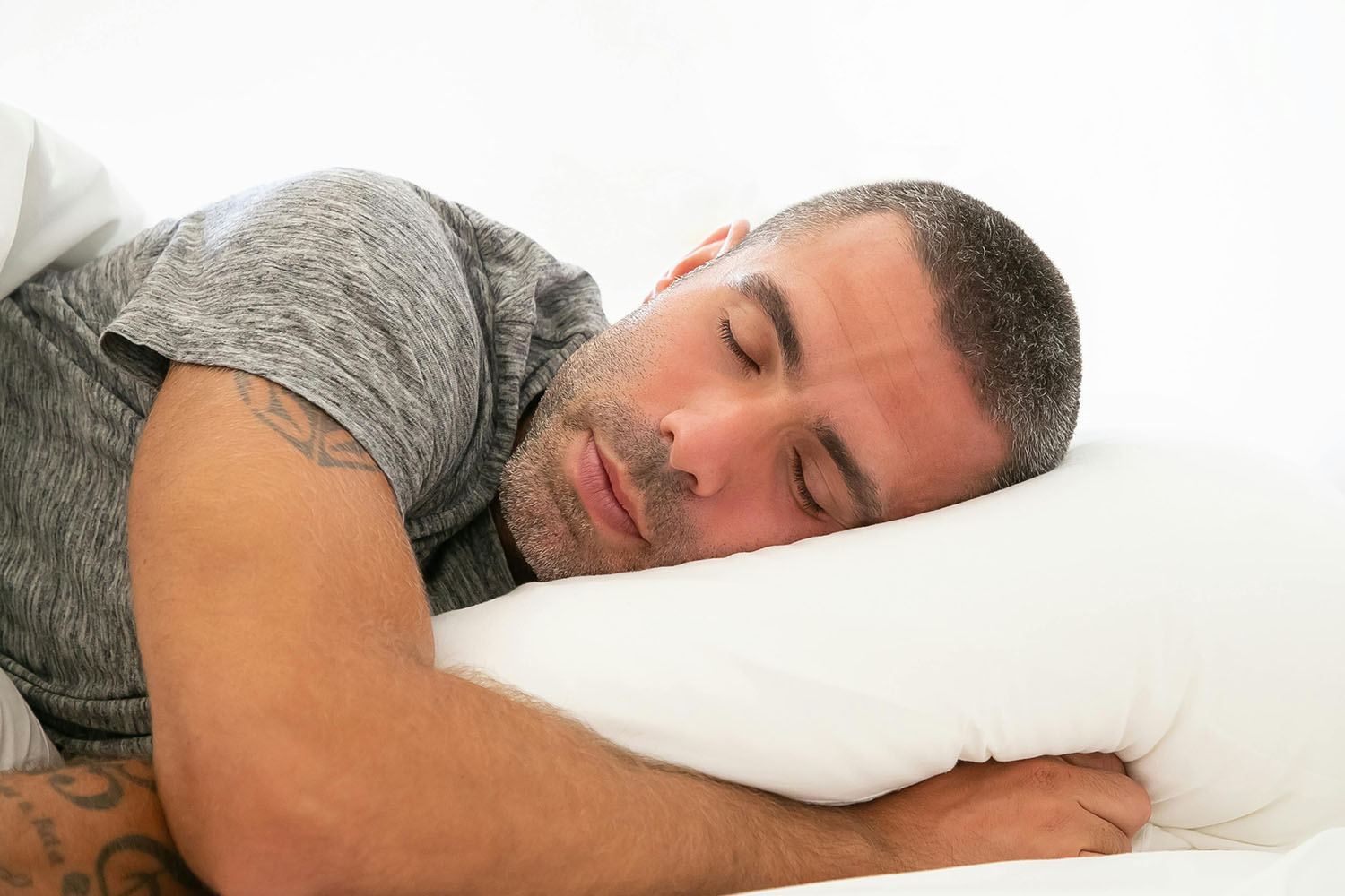 FOCL Sleep Gummies - Man enjoying restful sleep - Promotes calm and relaxation.