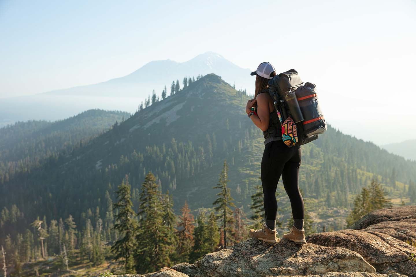 FOCL CBD gummies bag in wilderness hiking setting promoting natural pain relief and adventure readiness.