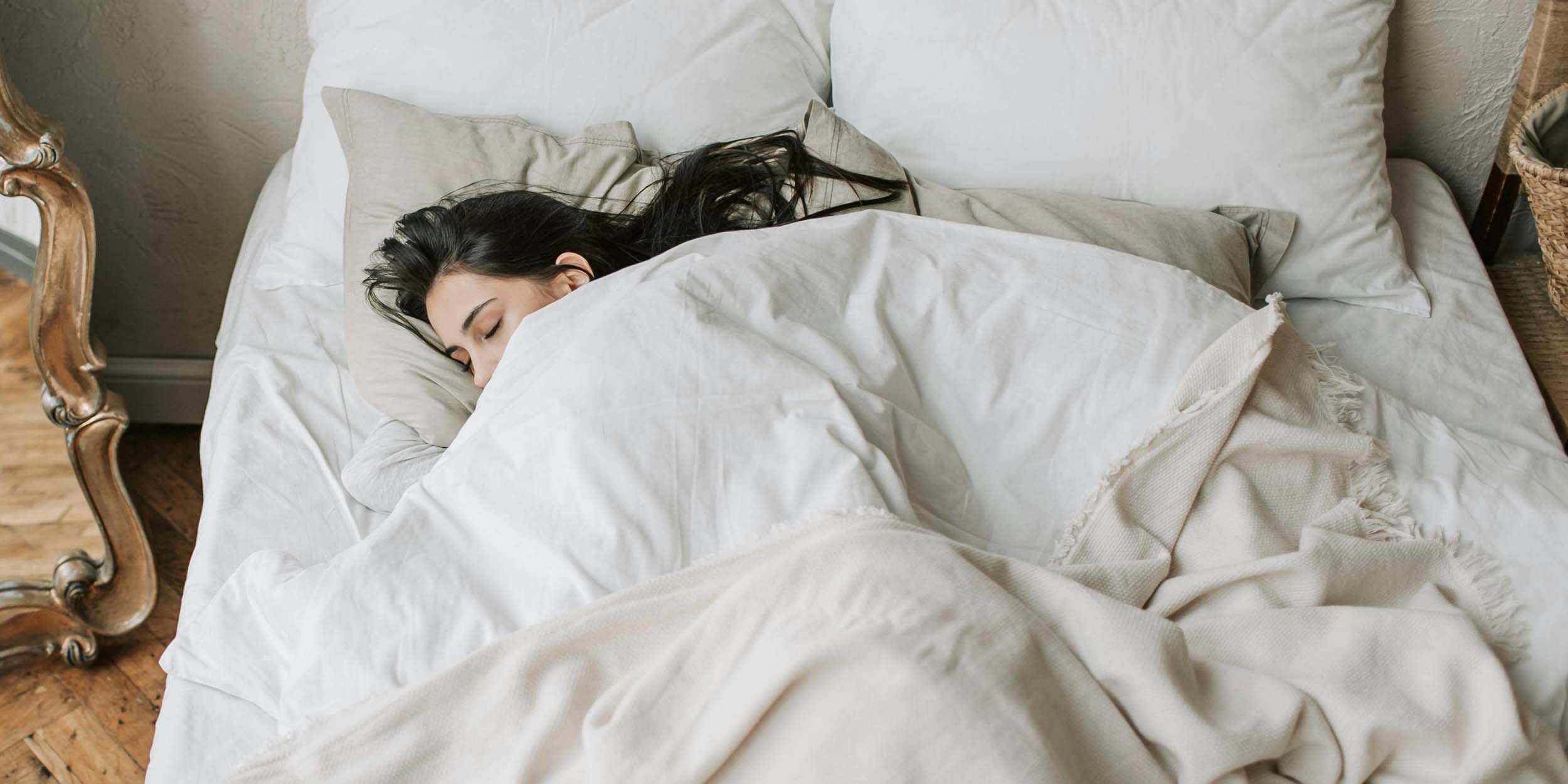 LP THC gummies on a bed, promoting better sleep with plant-based ingredients.