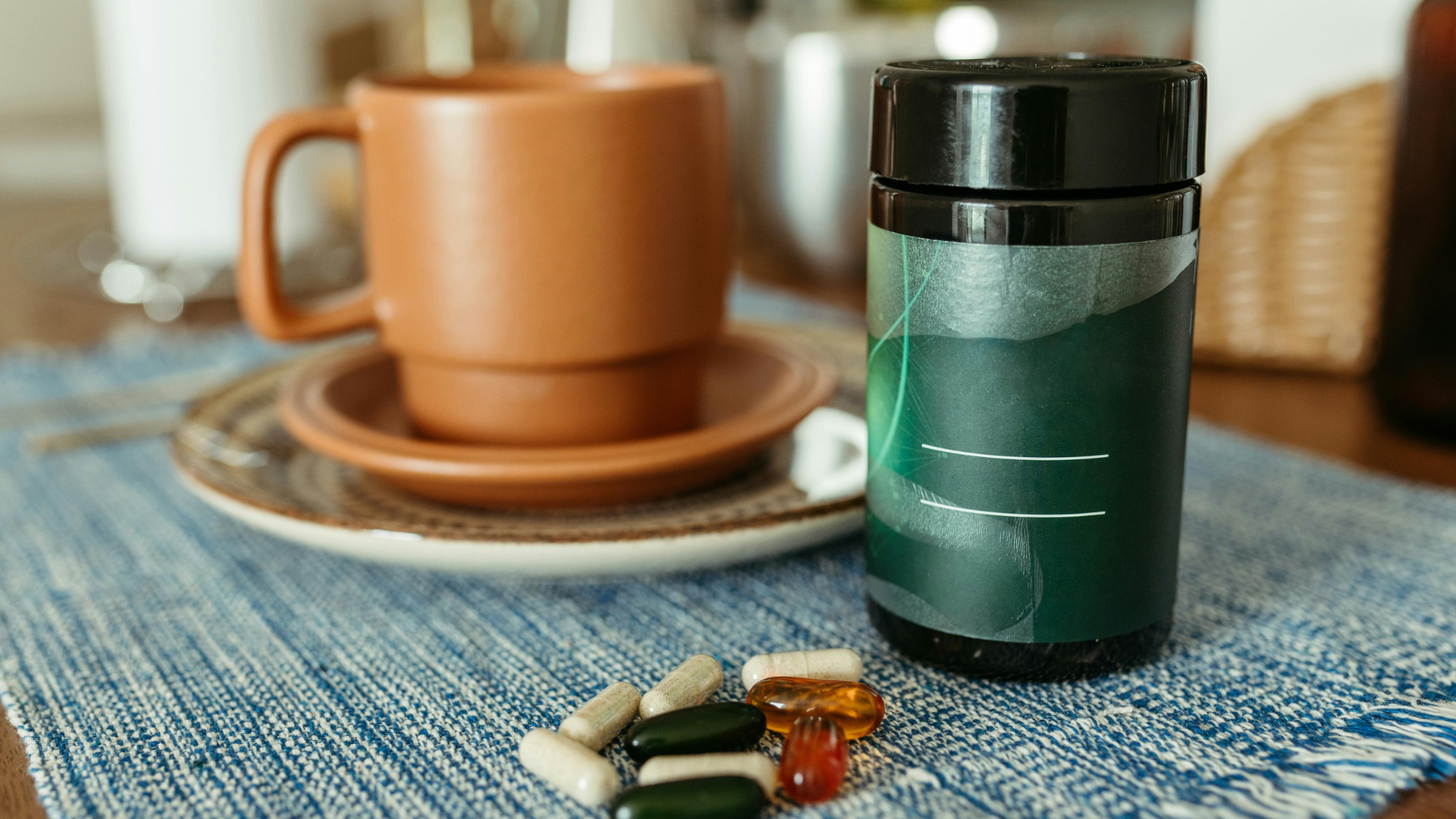 Supplement Bottle And Capsules On Table