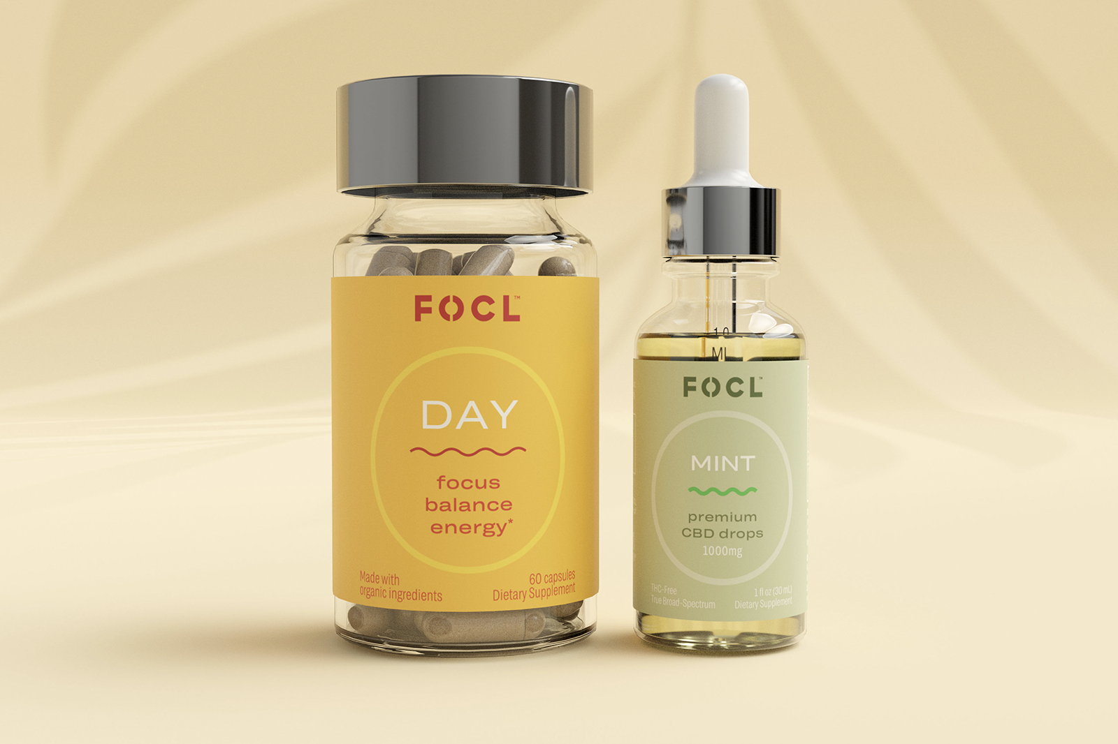 FOCL Day capsules next to FOCL Mint CBD Drops.