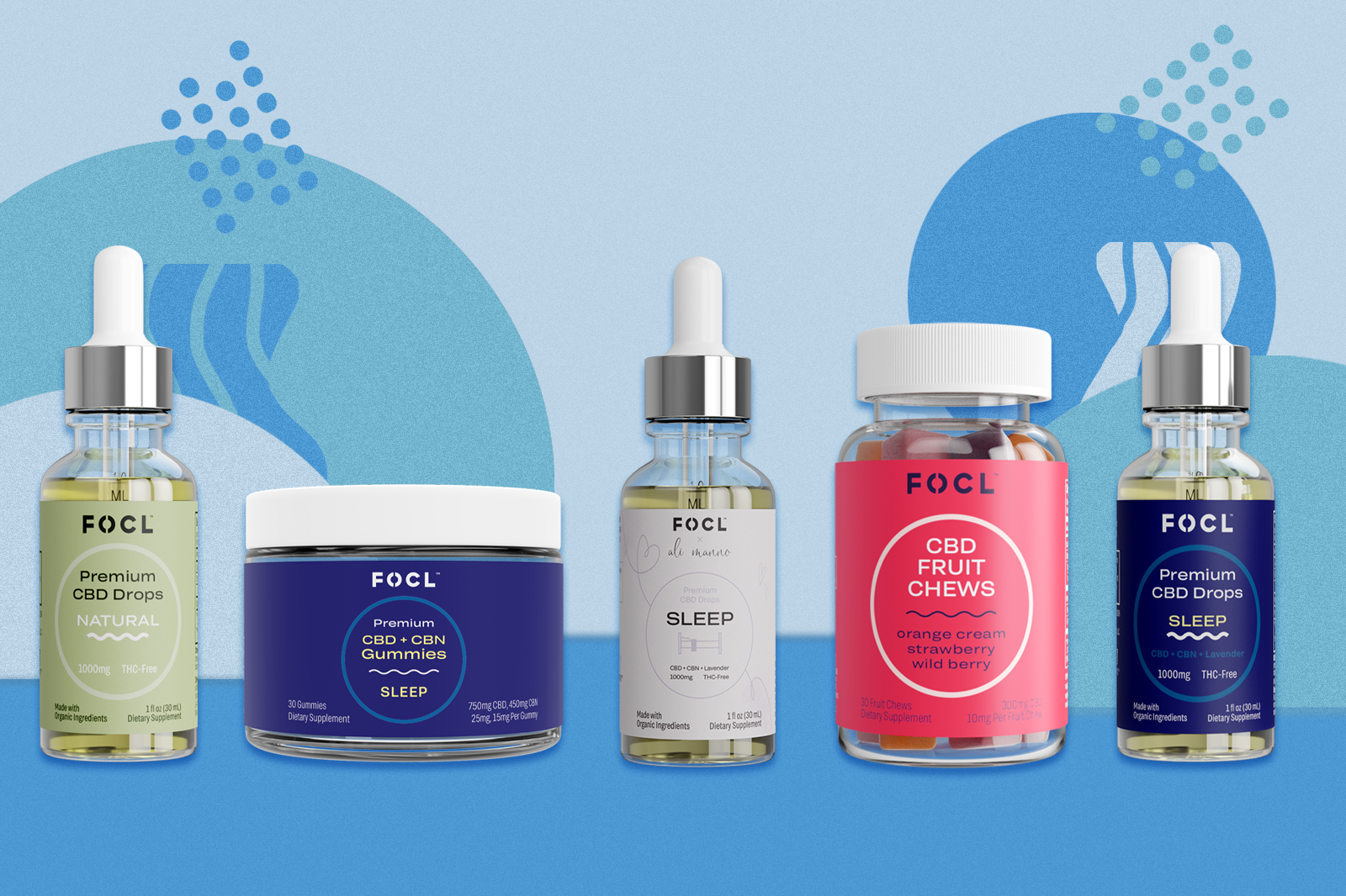 FOCL CBD products lined up on a blue pattern background.