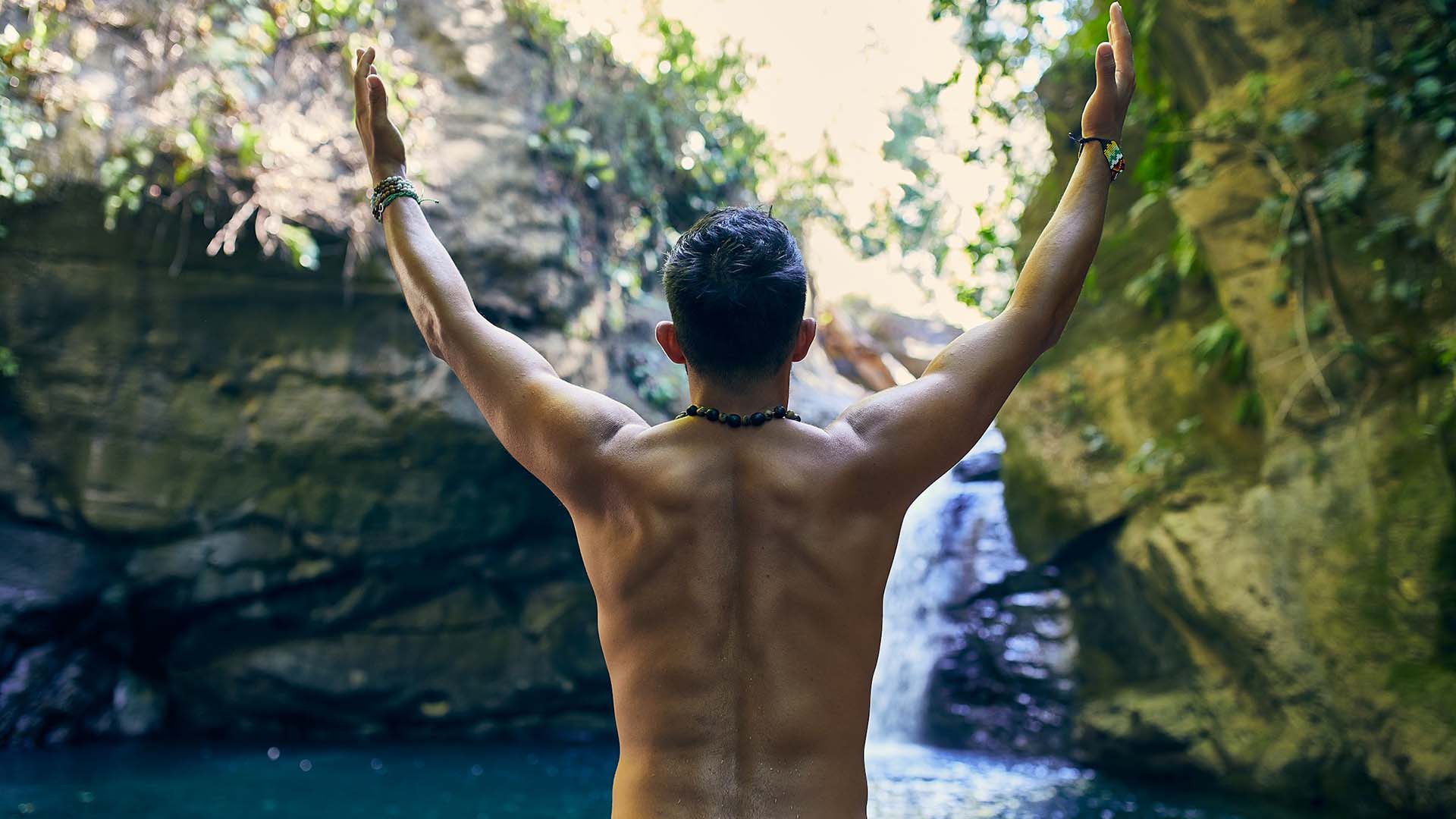 man standing near body of water