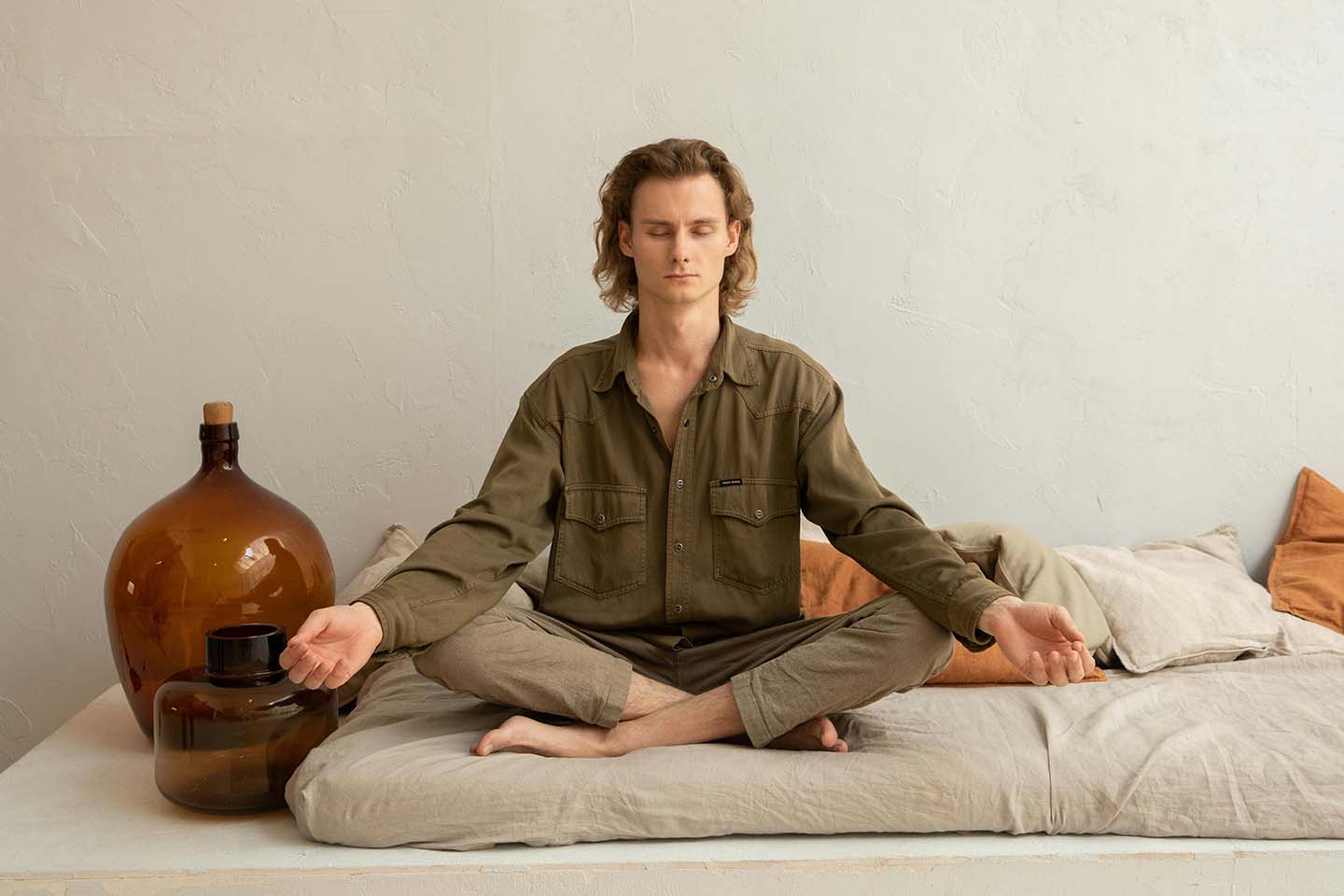 a man meditating in lotus pose