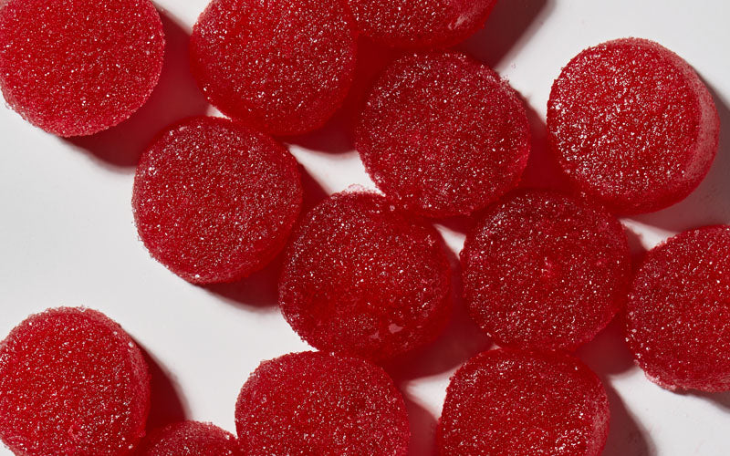 close-up of several red-colored gummies