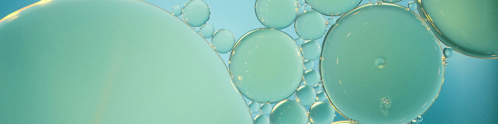 close-up of oil bubbles in blue green color