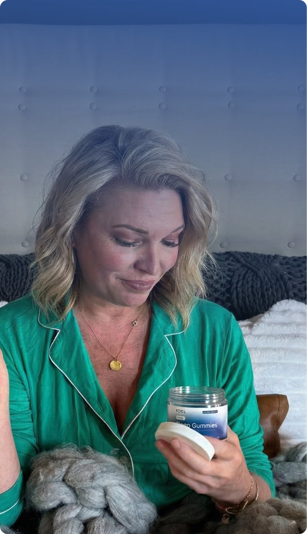 JenBanner - Woman wrapped in woolen blanket enjoying FOCL wellness supplement - Promoting calm and focus.