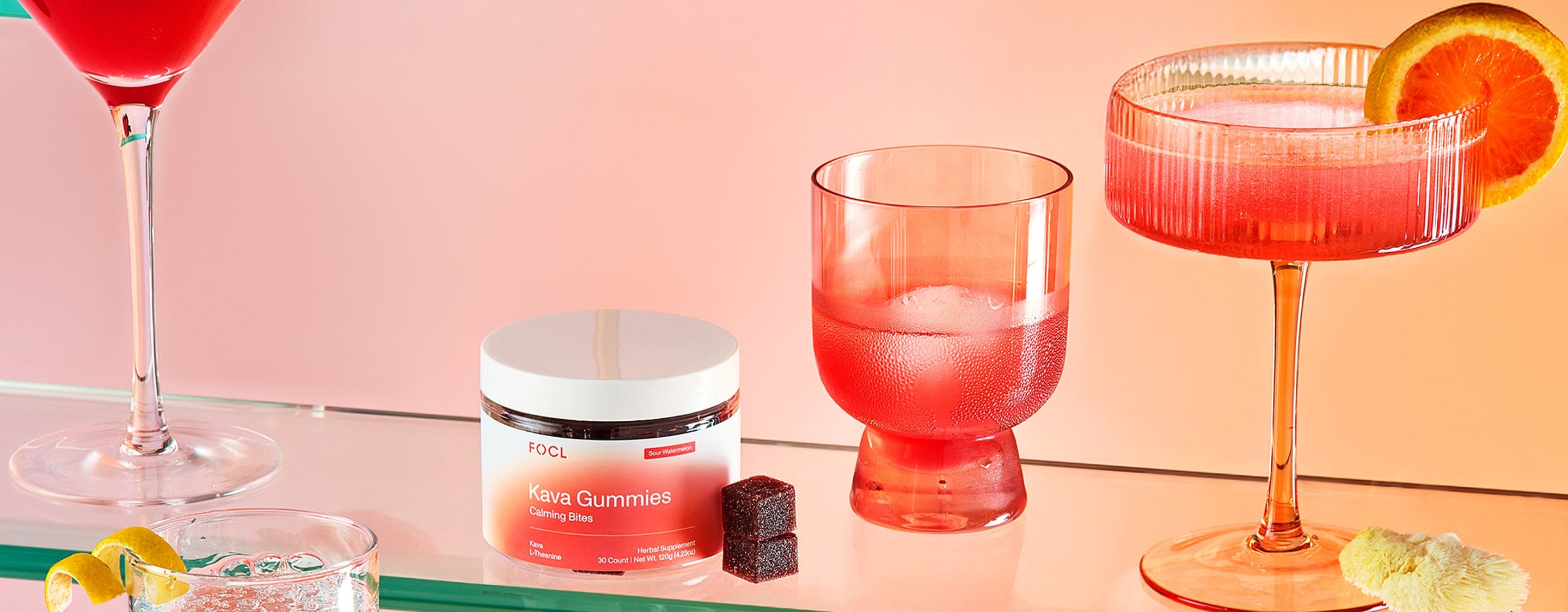 FOCL Kava Gummies displayed with elegant drinkware - Promotes calm and relaxation.