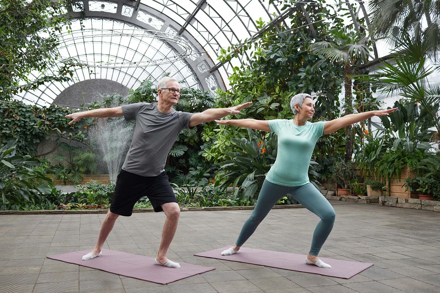 Old couple practicing yoga